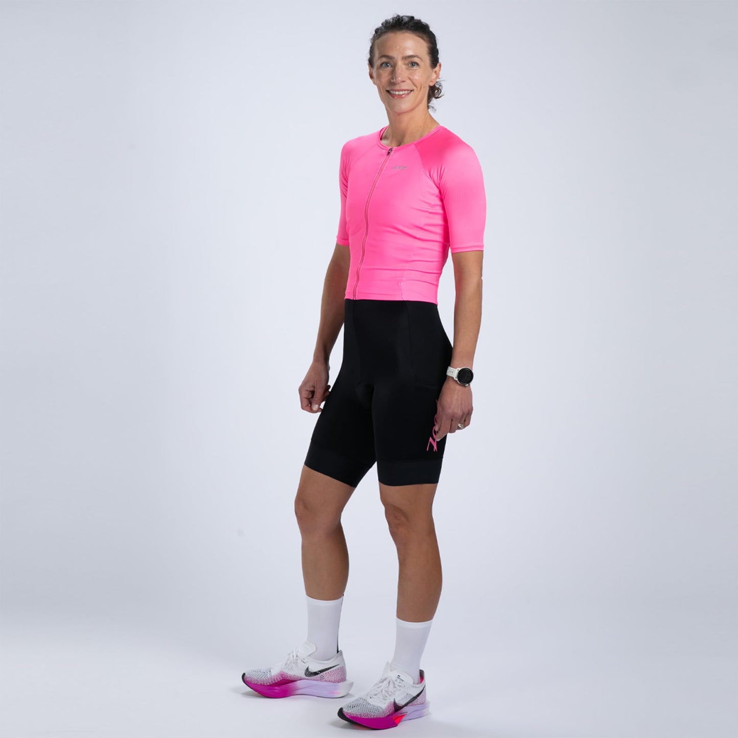 Zoot Women’s Core Tri Aero FZ Racesuit, Short Sleeve Moisture-Wicking Triathlon Suit, Plush Chamois & Race Day Storage - Bright Pink - Large