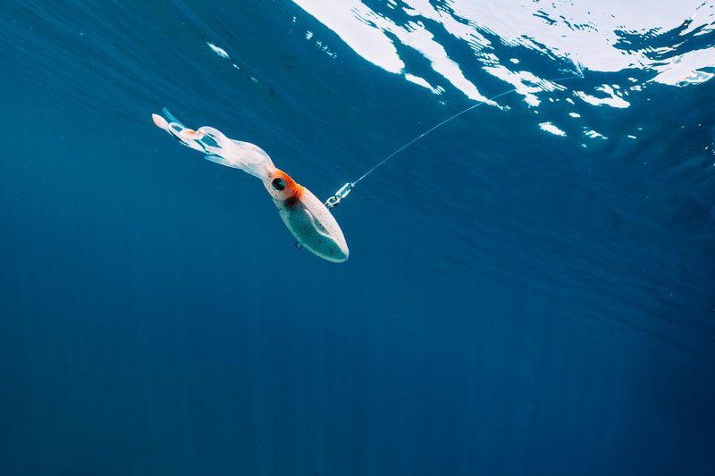 Nomad Design Squidtrex Patented Vibrating Fishing Lure- Scent Added TPE Soft Plastic Lure for Saltwater w/Strong BKK Assist Hooks, Fishing Bait that catches many species,110mm,1 3/4oz Green Gold Gizzy