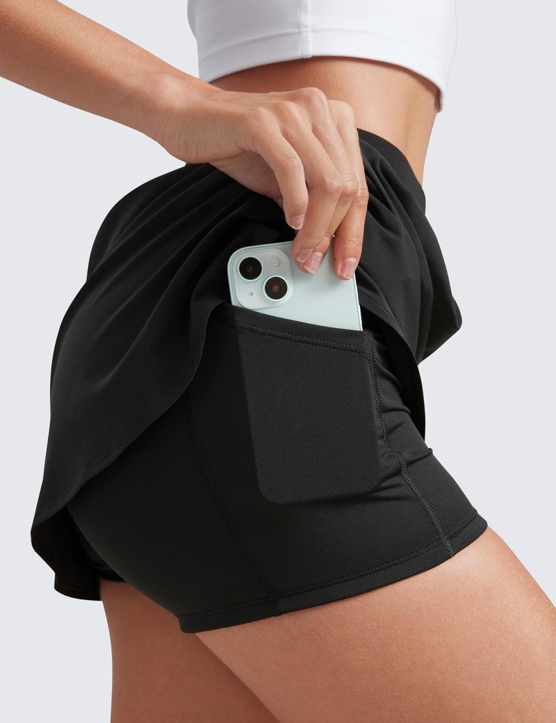 CRZ YOGA Dolphin Golf Skirts for Women A Line High Waisted Casual Athletic Mini Tennis Pickleball Skort with Zipper Pocket Black Medium