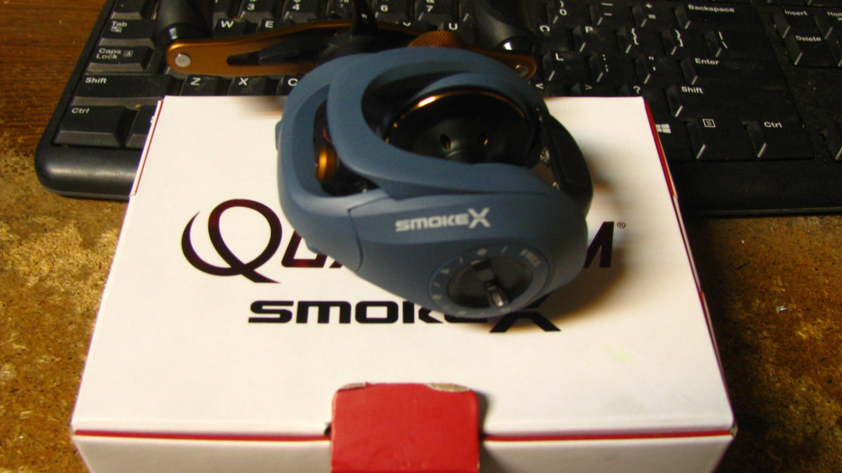 Quantum Smoke Baitcast Reel SMX100HPT - Left Hand, 9 Bearings, 7.3:1 Gear Ratio
