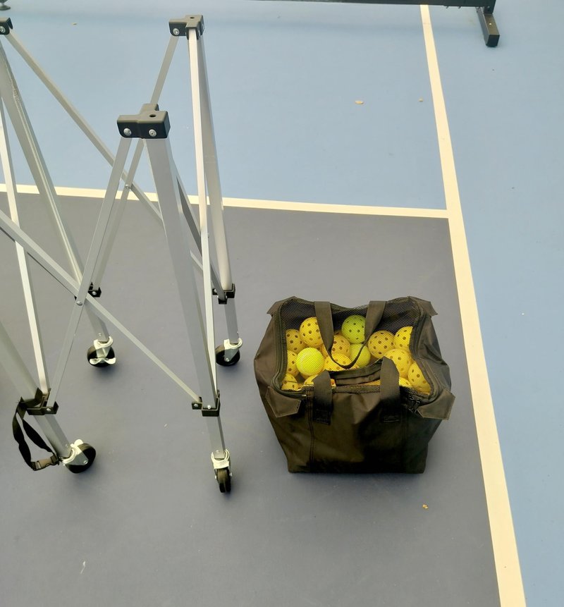 Portable tennis hopper for collecting products can hold 180 balls. The foldable tennis basket, pickleball basket, wheeled teaching vehicle, and the lightweight tennis ball carrier with wheels