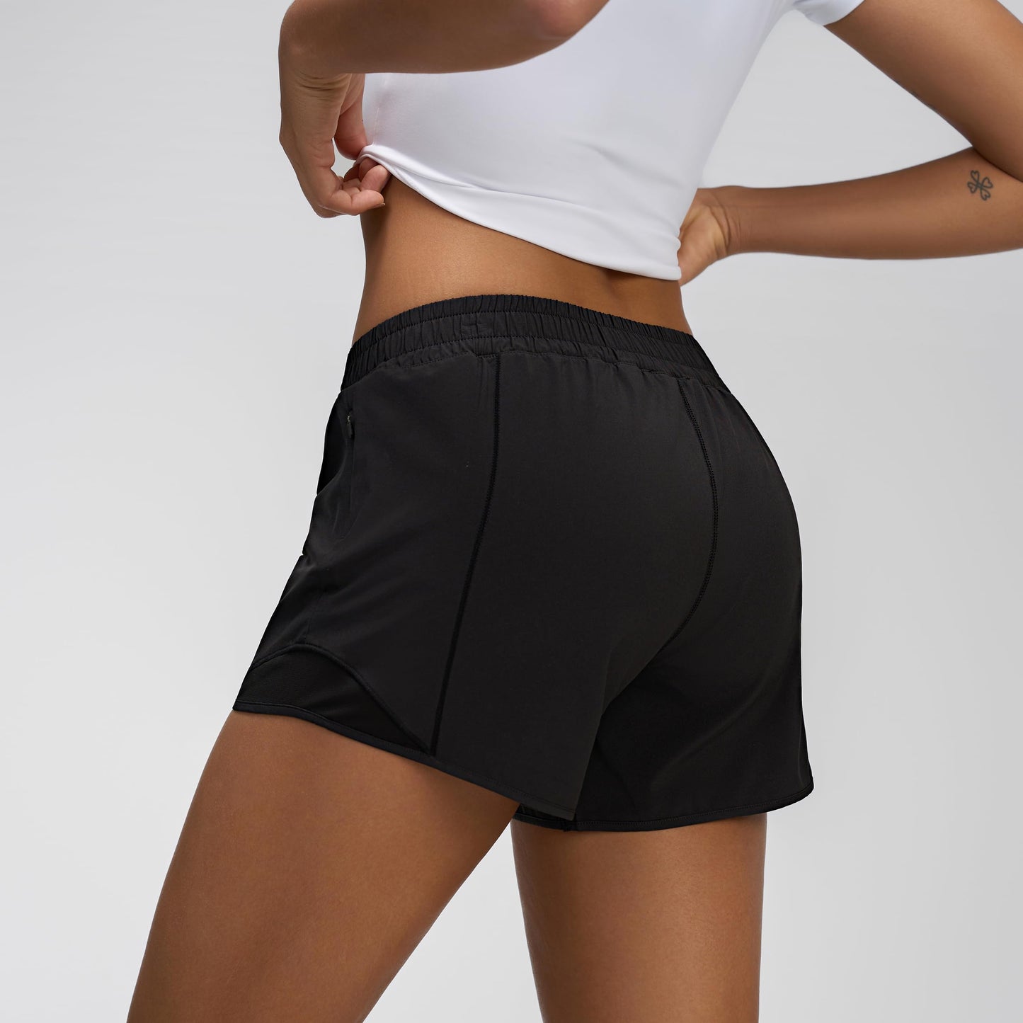 MCEDAR Women's Low Waisted Running Shorts 4" with Mesh-Lined Active Workout Quick Dry Gym Athletic Sports Short Zip Pocket Black/S