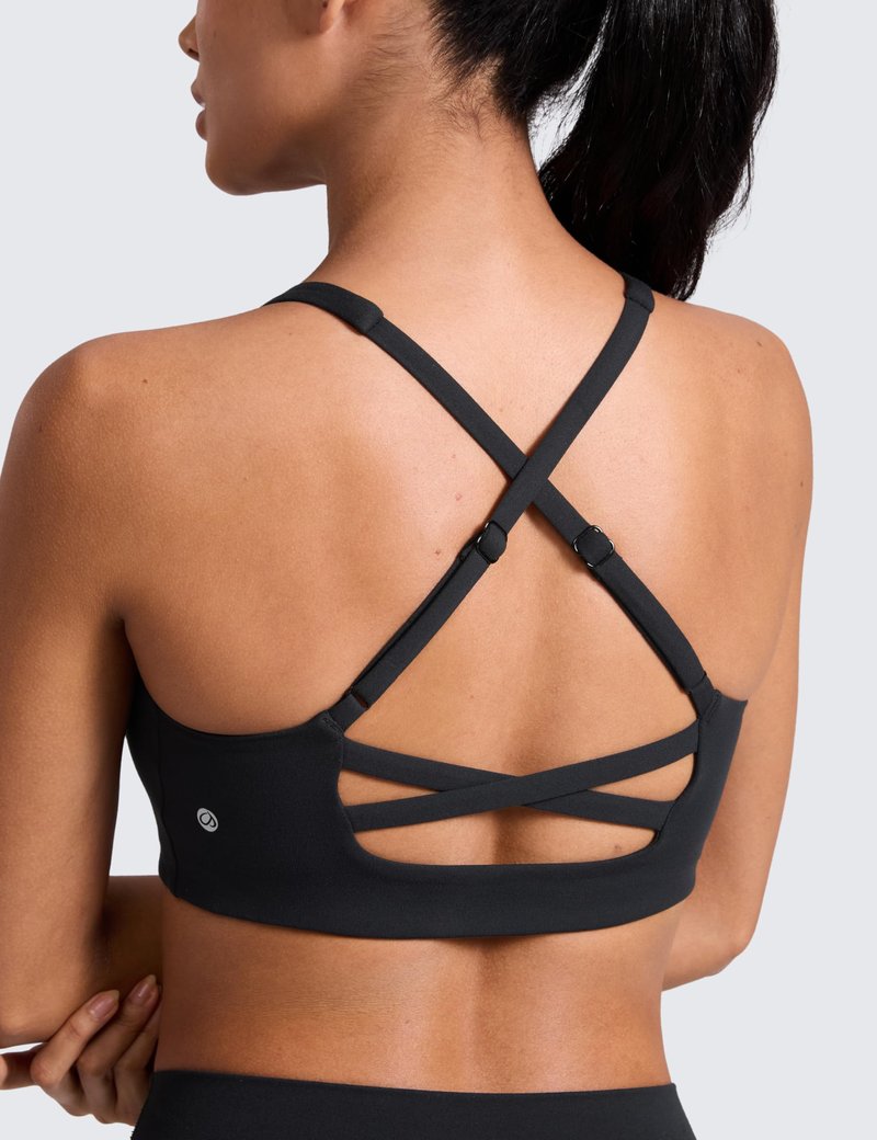 CRZ YOGA Butterlift Cross Back Sports Bras for Women - Scoop Neck Adjustable Straps Wireless Padded Pilates Workout Top Black Medium