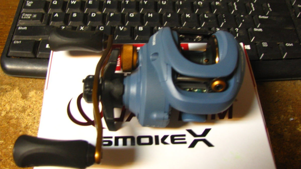 Quantum Smoke Baitcast Reel SMX100HPT - Left Hand, 9 Bearings, 7.3:1 Gear Ratio