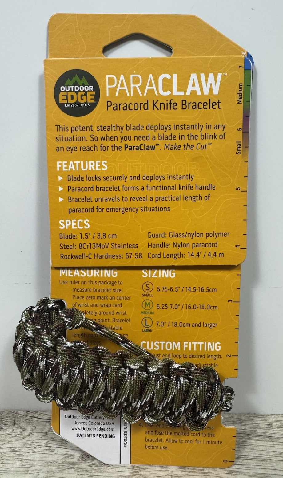 Outdoor Edge Paracord Survival Bracelet with Fixed Blade Knife - Camouflage, Medium